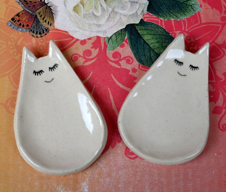 Cat ring holder. Teeny cat trinket dish. Teaspoon rest. Tea bag rest. Pill holder. Chopstick rest. Tea light holder. Kitty ghost