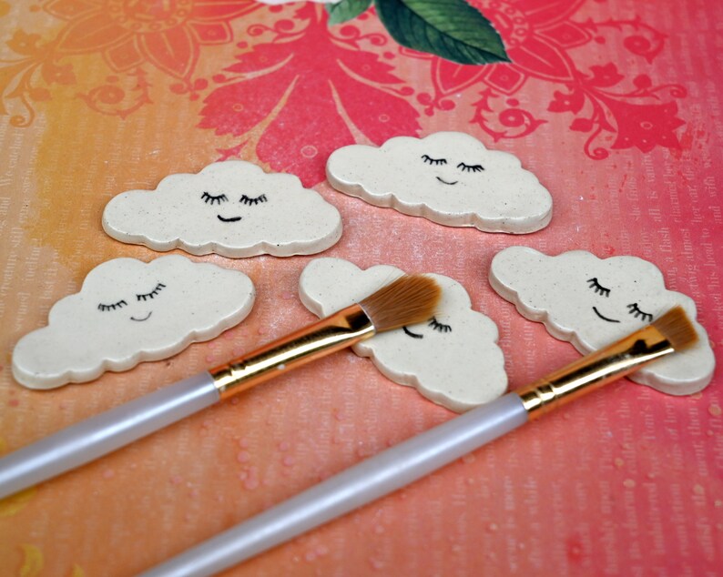 Cloud chopstick rest. Paint brush rest. Pen rest. Smiling cloud. Shower favors. Teeny one ring holder. Chopstick rest. Knife rest