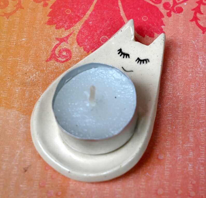 Cat ring holder. Teeny cat trinket dish. Teaspoon rest. Tea bag rest. Pill holder. Chopstick rest. Tea light holder. Kitty ghost