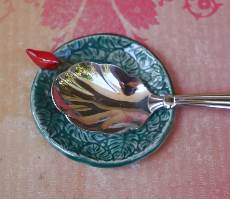 Red Cardinal ring holder. Monstera leaf tea bag rest. Teaspoon rest. Ring holder. Trinket dish. Chopstick rest. Tea light holder.