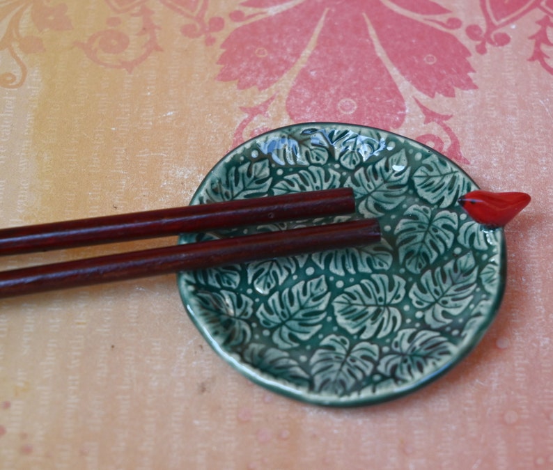 Red Cardinal ring holder. Monstera leaf tea bag rest. Teaspoon rest. Ring holder. Trinket dish. Chopstick rest. Tea light holder.