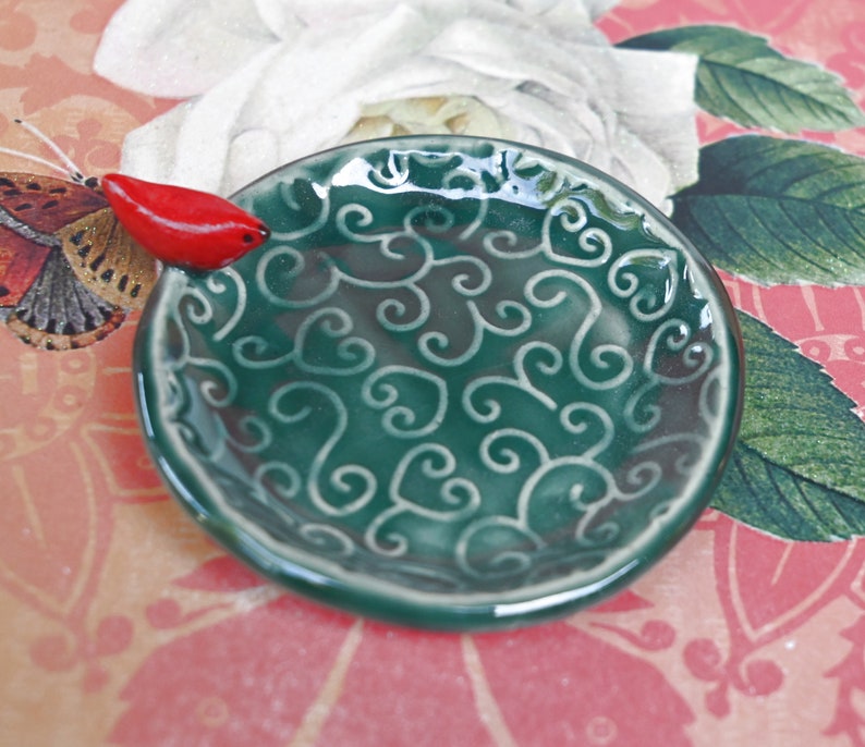 Red Cardinal ring holder. Tea bag rest. Teaspoon rest. Ring holder. Trinket dish. Chopstick rest. Tea light holder. Pill holder.