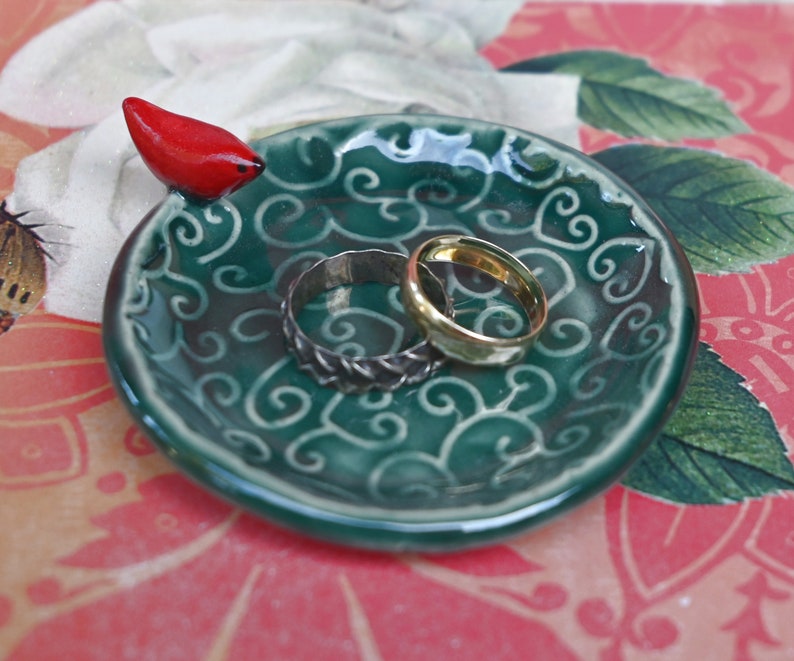 Red Cardinal ring holder. Tea bag rest. Teaspoon rest. Ring holder. Trinket dish. Chopstick rest. Tea light holder. Pill holder.