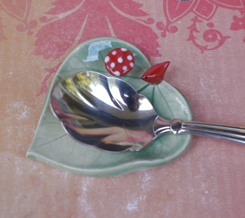 Leaf ring holder. Mushroom ring holder. Pill holder. Chopstick rest. Teaspoon rest. Red cardinal ring holder. Paint brush rest