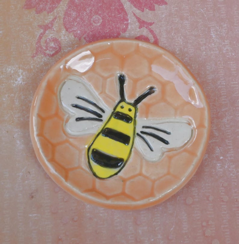Honeybee teaspoon rest. Hand painted ceramic bee ring holder. Pill holder. Teaspoon rest. Tea bag rest. Tealight holder. Chopstick rest.