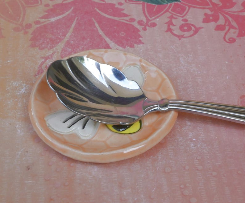 Honeybee teaspoon rest. Hand painted ceramic bee ring holder. Pill holder. Teaspoon rest. Tea bag rest. Tealight holder. Chopstick rest.
