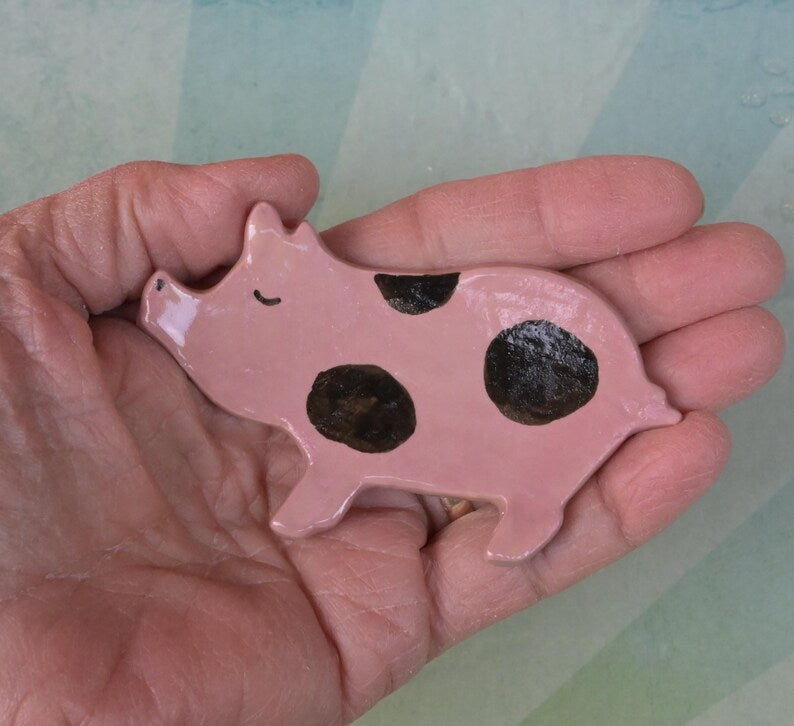 Pig ring holder. ONE Piglet teaspoon rest. Teaspoon rest. Coffee spoon rest. Chopstick rest. Teeny trinket dish. Pill holder.