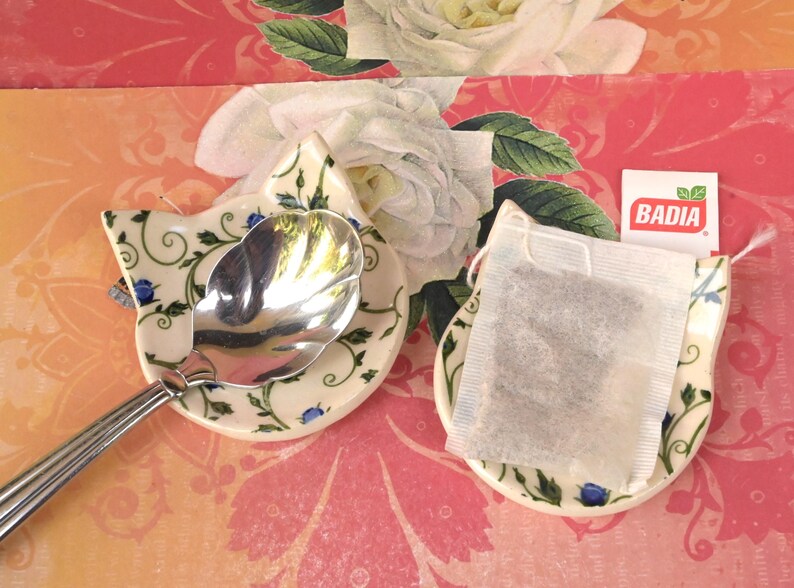 Teeny cat ring holder. Chop stick rest. Teaspoon rest. Tea bag rest. Ceramic cat ring dish. Pill holder. Tea light holder. Blue rose dish.