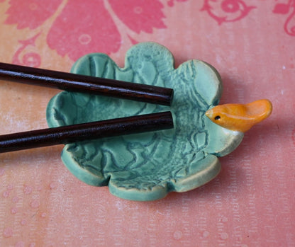 Teeny bird ring holder. Flower ring bowl. Teaspoon rest. Tea bag rest. Coffee spoon rest. Pill holder. Chopstick rest. Teeny trinket dish