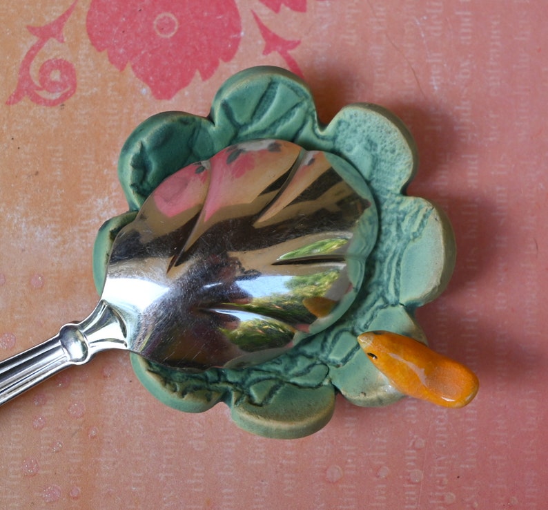 Teeny bird ring holder. Flower ring bowl. Teaspoon rest. Tea bag rest. Coffee spoon rest. Pill holder. Chopstick rest. Teeny trinket dish