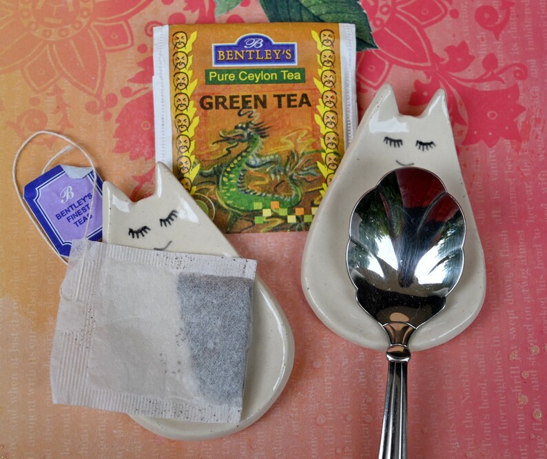 Cat ring holder. Teeny cat trinket dish. Teaspoon rest. Tea bag rest. Pill holder. Chopstick rest. Tea light holder. Kitty ghost