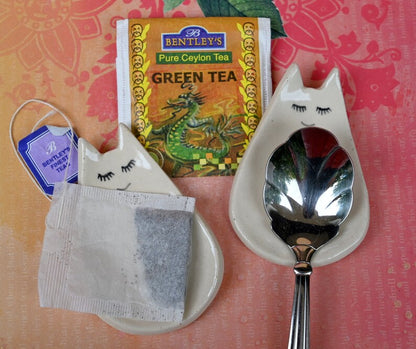 Cat ring holder. Teeny cat trinket dish. Teaspoon rest. Tea bag rest. Pill holder. Chopstick rest. Tea light holder. Kitty ghost