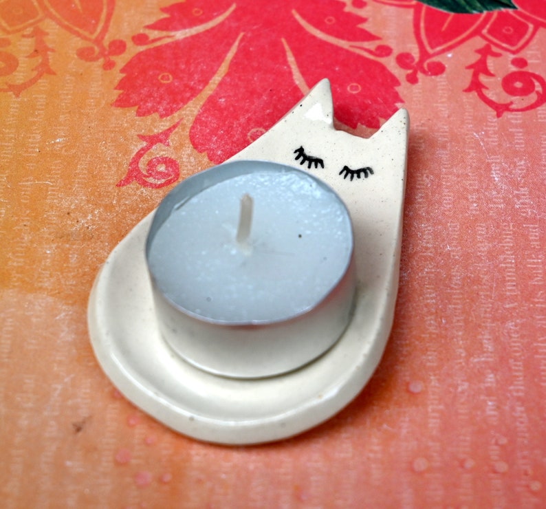 Cat ring holder. Teeny cat trinket dish. Teaspoon rest. Tea bag rest. Pill holder. Chopstick rest. Tea light holder. Kitty ghost