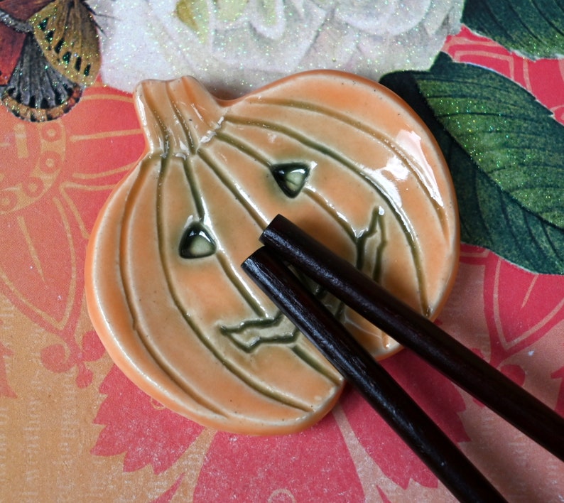 Pumpkin ring holder. Teaspoon rest. Coffee spoon rest. Chopstick rest. Small Halloween trinket dish. Pill holder. Spooky tea light holder.