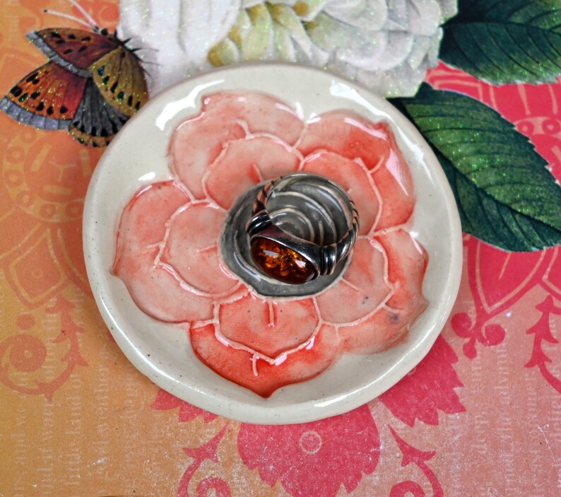 Poppy flower ring holder. Tea bag rest. Teaspoon rest. Coffee spoon rest. Trinket dish. Chopstick rest. Tea light holder. Poppy pill holder