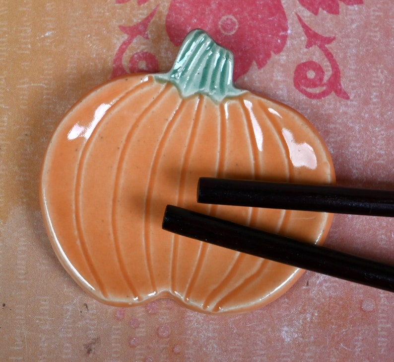 Teaspoon rest. Pumpkin ring holder. Coffee spoon rest. Chopstick rest. Thanksgiving trinket dish. Pill holder. Spooky tea light holder.