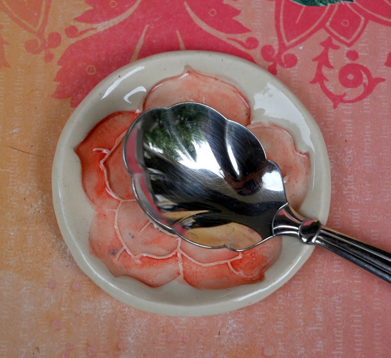 Poppy flower ring holder. Tea bag rest. Teaspoon rest. Coffee spoon rest. Trinket dish. Chopstick rest. Tea light holder. Poppy pill holder