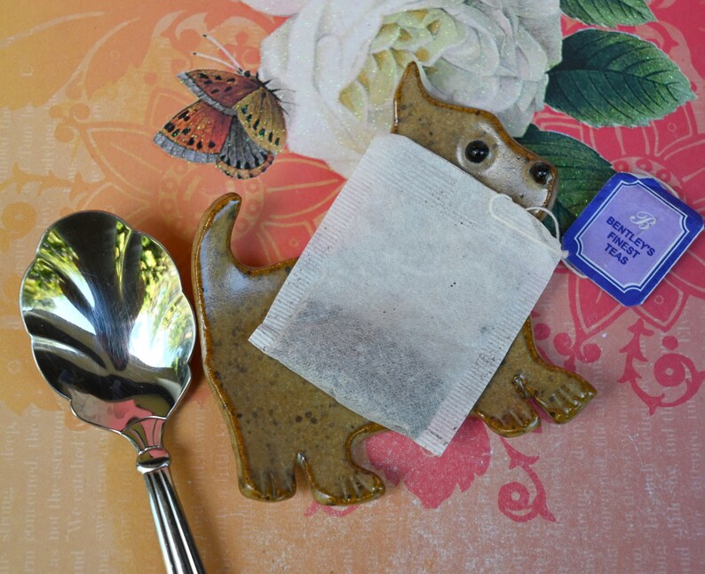Teeny dog ring holder. Tea bag rest. Teaspoon rest. Coffee spoon rest. Tea bag rest. Scottish Terrier. Chopstick rest. Trinket dish. Scottie