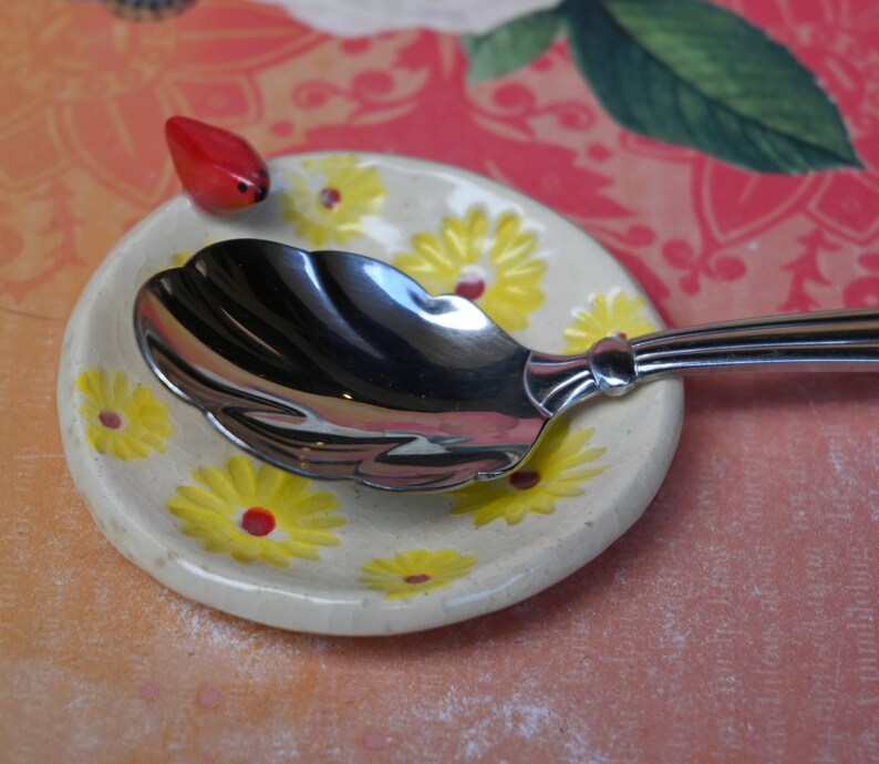 Red Cardinal ring holder. Daisy dish. Tea bag holder. Teaspoon rest. Coffee spoon rest. . Trinket dish. Chopstick rest. Tea light holder