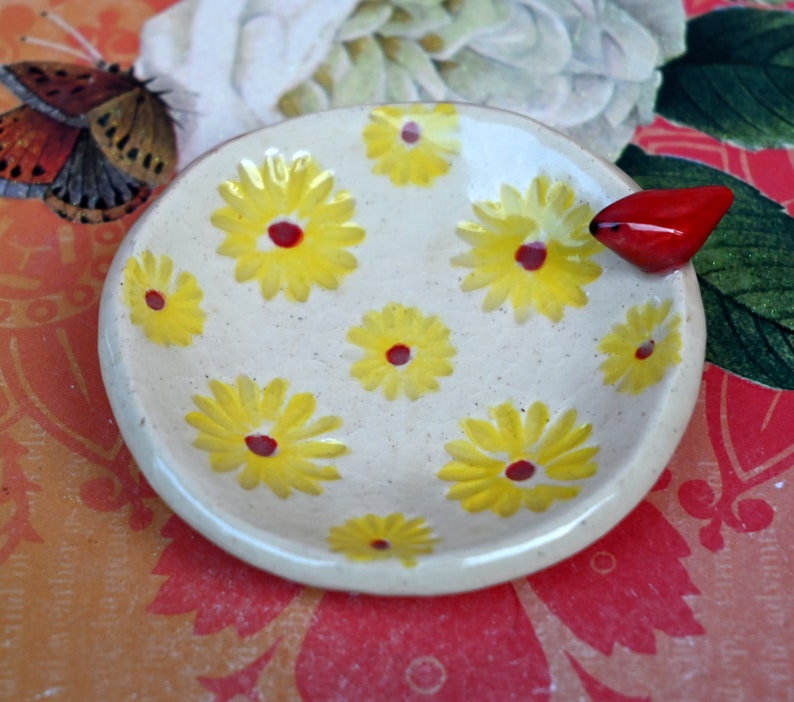 Red Cardinal ring holder. Daisy dish. Tea bag holder. Teaspoon rest. Coffee spoon rest. . Trinket dish. Chopstick rest. Tea light holder