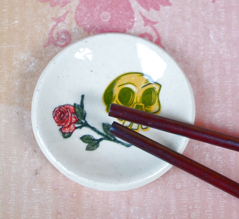 Skull and rose ring holder. Teaspoon rest. Tea bag rest. Spooky skull and rose dish. Pill holder. Chopstick rest. Candy bowl
