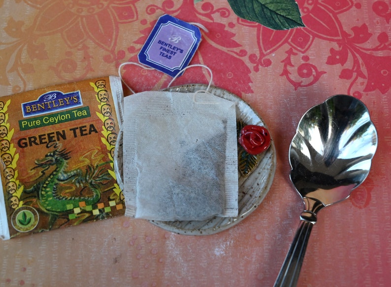 Rose teeny ring holder. Tea bag rest. Teaspoon rest. Coffee spoon rest. Sushi chopstick rest. Tea bag rest. Pill holder. Trinket dish