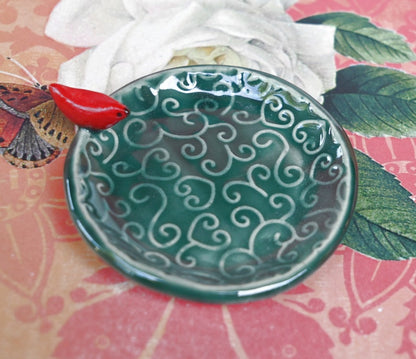 Red Cardinal ring holder. Tea bag rest. Teaspoon rest. Ring holder. Trinket dish. Chopstick rest. Tea light holder. Pill holder.