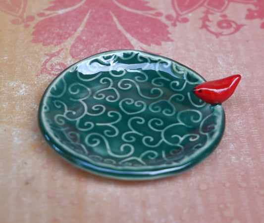 Red Cardinal ring holder. Tea bag rest. Teaspoon rest. Ring holder. Trinket dish. Chopstick rest. Tea light holder. Pill holder.