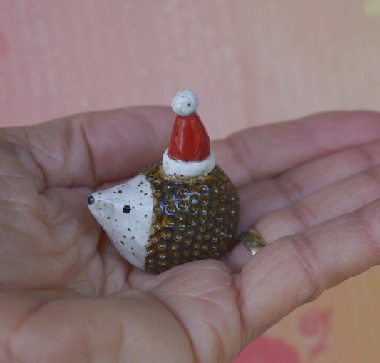 Hedgehog figurine. ONE Santa hedgehog. Ceramic hedgehog. Miniature Christmas hedgehog. Hand sculpted hand painted hedgehog. Xmas hedgehog