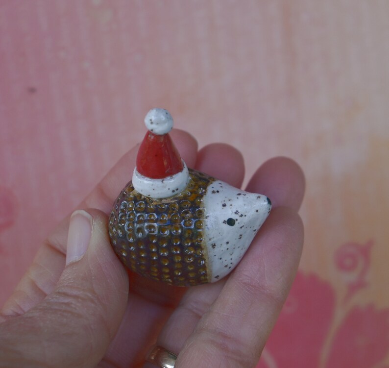 Hedgehog figurine. ONE Santa hedgehog. Ceramic hedgehog. Miniature Christmas hedgehog. Hand sculpted hand painted hedgehog. Xmas hedgehog
