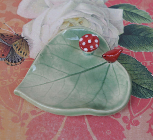Leaf ring holder. Mushroom ring holder. Pill holder. Chopstick rest. Teaspoon rest. Red cardinal ring holder. Paint brush rest