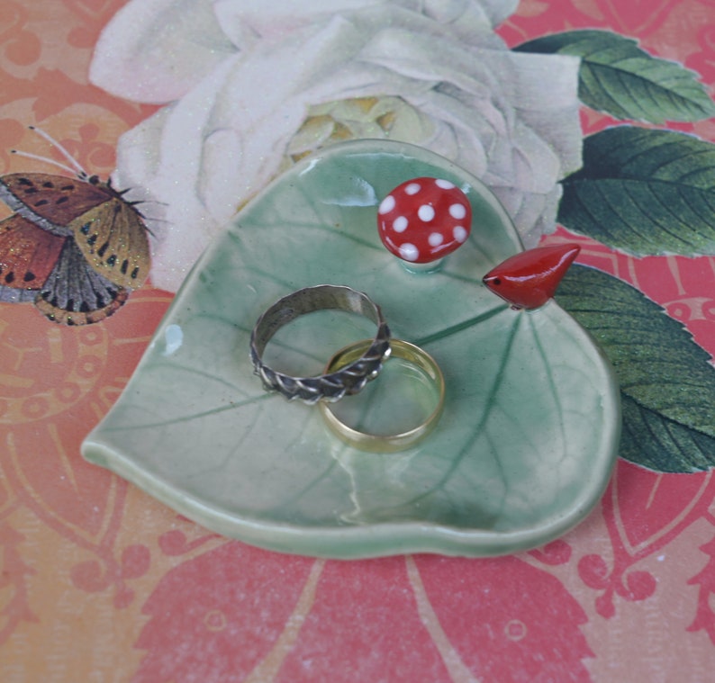 Leaf ring holder. Mushroom ring holder. Pill holder. Chopstick rest. Teaspoon rest. Red cardinal ring holder. Paint brush rest