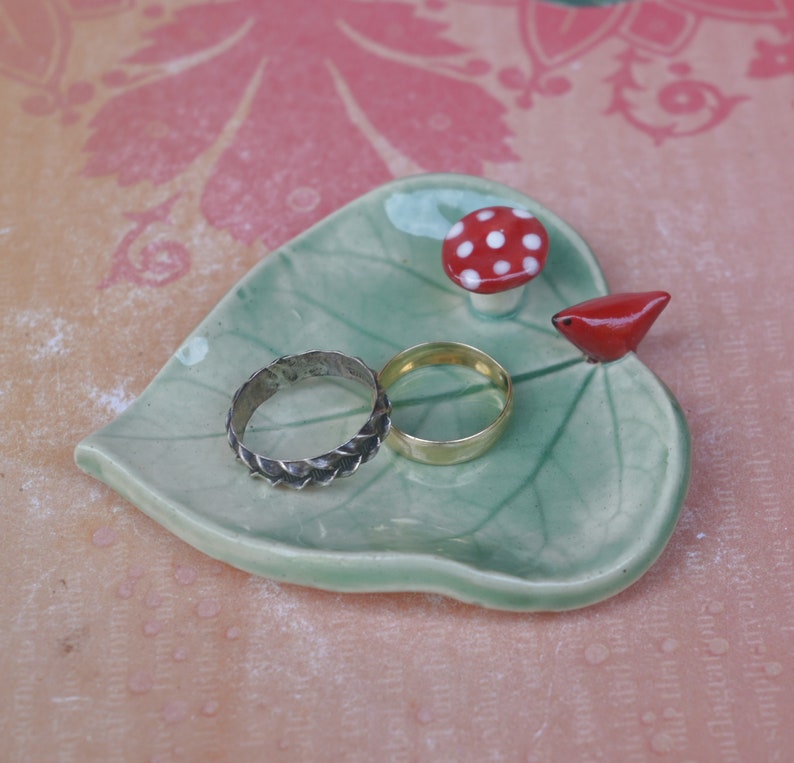 Leaf ring holder. Mushroom ring holder. Pill holder. Chopstick rest. Teaspoon rest. Red cardinal ring holder. Paint brush rest