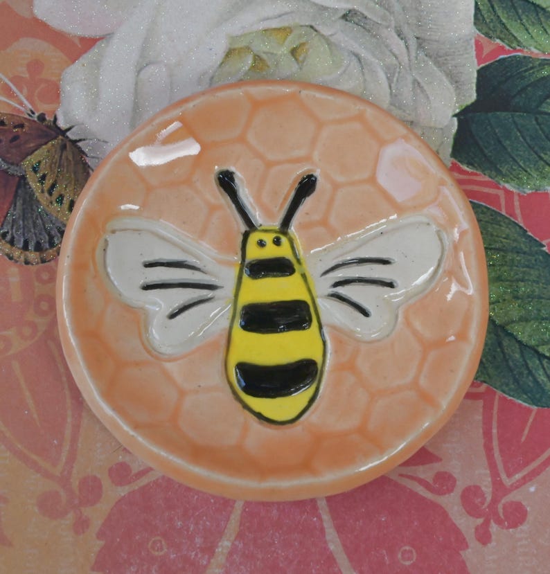 Honeybee teaspoon rest. Hand painted ceramic bee ring holder. Pill holder. Teaspoon rest. Tea bag rest. Tealight holder. Chopstick rest.