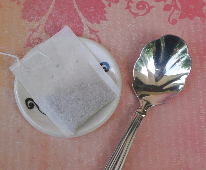 Dinosaur ring holder. ONE Tea bag holder. Teaspoon rest. Prehistoric ring holder. Trinket dish. Tea bag rest. Chopstick rest. Pill holder.