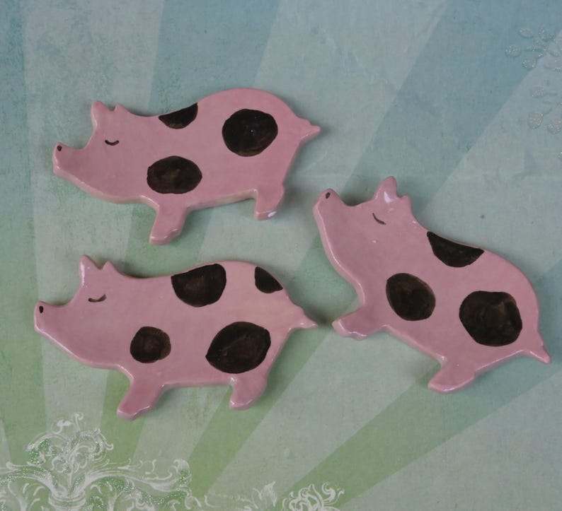 Pig ring holder. ONE Piglet teaspoon rest. Teaspoon rest. Coffee spoon rest. Chopstick rest. Teeny trinket dish. Pill holder.