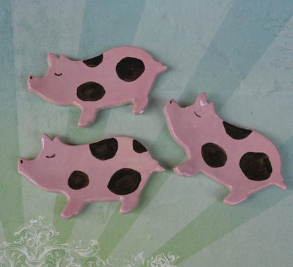 Pig ring holder. ONE Piglet teaspoon rest. Teaspoon rest. Coffee spoon rest. Chopstick rest. Teeny trinket dish. Pill holder.
