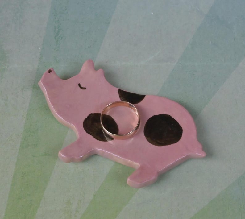 Pig ring holder. ONE Piglet teaspoon rest. Teaspoon rest. Coffee spoon rest. Chopstick rest. Teeny trinket dish. Pill holder.