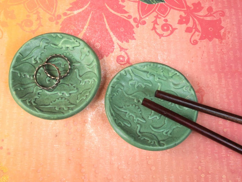 Dinosaur ring holder. ONE Tea bag holder. Teaspoon rest. Prehistoric ring holder. Trinket dish. Tea bag rest. Chopstick rest. Pill holder.